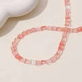 Detailed view of pink and clear tulip-shaped beads for DIY jewelry making and crafts - Scallop (11#) / 1 Piece / Pink