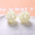 Detail view of woven light green acrylic bead hollow spheres for DIY hair accessories - Light Yellow (A5-2 #4)