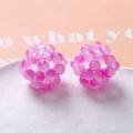 Handcrafted pink woven bead spheres for DIY jewelry on a white textured plate - Rose Red (A5-2 #5)
