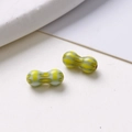 Macro detail of 8mm peanut shaped glass beads with yellow and green ripple patterns for DIY - Style 12 (12#) / 1 Piece/Pack