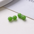 Detail view of two green peanut-shaped glass beads with textured surface for DIY jewelry - Style 7(7#) / 1 Piece/Pack