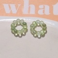 Close-up of iridescent light green bead rings for DIY earring and jewelry making - 1 Piece / Fruit Green