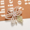 Detail of handmade woven pearl flower hairclip with green leaf and teardrop bead - Flower Shape (1 Piece)