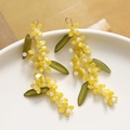 Detail of handmade green leaf and yellow flower tassel earrings with resin beads - Yellow Flower Tassel Pendant (Single Flower)