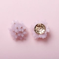 Detail view of handmade pink floral jewelry components with matte petals and gold metal base - Light Purple