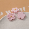 Detail showing pink resin cherry blossom charms with yellow stamens for DIY crafts - Light Pink
