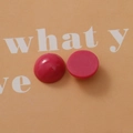 Macro detail of dark rose pink resin cabochons showing smooth dome and flat back - Rose Red