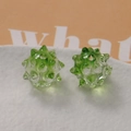 Detailed view of two transparent green spiked beads with center holes for DIY jewelry - Ice Translucent Light Green