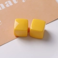 Detailed macro view of 20mm glossy yellow square resin earring charms for DIY jewelry making - Yellow