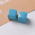 Detailed view of 20mm sky blue glossy resin cube beads for DIY jewelry making - Teal