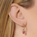 Elegant gold beaded hoop earrings with a rectangular red gemstone pendant on a female model - Drop Earrings / Gold Rectangle Rose Red Drop
