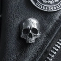 Macro detail of retro skull pin with vintage silver finish on black leather jacket - Hammered Skull (19)