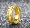 Detailed macro view of wide gold titanium ring with geometric grooves and brushed finish - Size 6 / Gold