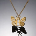 Golden stainless steel butterfly necklace with letter B pendant on grey background - Letter B / Silver