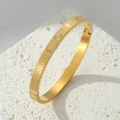 Gold-tone titanium steel JESUS bangle with cross symbol and matte sandblasted finish - Gold