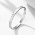 Minimalist silver stainless steel bracelet featuring an engraved Greek Key pattern and clasp - Steel