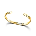 Macro detail of polished gold C-shape cuff bracelet with ENCOUNTER engraving - Engraved Style / Gold