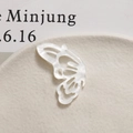 Detailed view of a white hollow butterfly charm with pearl luster for DIY hair accessories - Left Wing / White