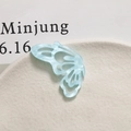 Macro shot of light blue hollow butterfly pendant with marble texture for DIY jewelry - Left Wing / Blue