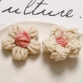 Close-up of handmade crochet puff flowers in white and pink for DIY accessory projects - Cream Coffee Pink Center