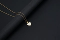 Golden heart necklace with shell inlay and metal letter E on a black background - Shell Heart Letter E (With Chain)