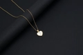 Golden heart necklace with letter I and white shell inlay on black display - Shell Heart Letter I (With Chain)