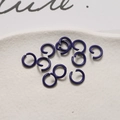 Macro view of purple lacquered metal jump rings for DIY jewelry making and crafting - Blue Purple