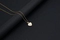 Golden heart shell necklace featuring an artistic letter Z pendant with a cross chain - Shell Heart Letter Z (With Chain)