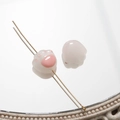 Macro detail of translucent pink cat paw glass beads for DIY jewelry making and crafts - Pink And White Cat Paw Loose Bead / Pink (126# Straight Hole)