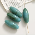 Macro di perle acriliche ovali blu fumé con trama marmorea per creazione gioielli - Verde Lago