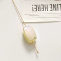 Macro view of a rectangular iridescent bead on a golden metal pin for DIY jewelry making - 1 Piece (18*11mm) / Yellow