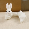 Detail of cute resin white rabbit figurines with pink ears for DIY accessories - Hand Raising Head Turning Style