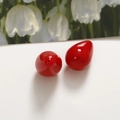 Macro shot of two glossy red waterdrop resin beads for DIY jewelry making - 1 Piece / Red