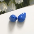 Close-up of translucent dark blue teardrop resin beads showing hole detail and luster - 1 Piece / Blue