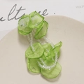 Detail of light green tulle flower petals and crystal beads for DIY hair accessory making - Green