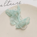 Detailed view of mint green tulle flower hair accessory with delicate crystal bead tassels - Light Green