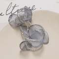 Detail of long fringe crystal tulle flower pendant showing elegant grey fabric petals - Gray