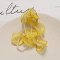 Detail of yellow tulle flower petals with crystal beads for DIY jewelry making and crafts - Yellow