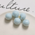 Macro detail of light blue sequin balls with gold metal loops for DIY jewelry making - Light Blue
