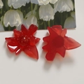 Macro detail of red translucent resin flower accessories with gold foil inclusions - Red