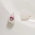 Detailed view of DIY resin ghost charms with purple heart gems and golden jump rings - Jelly White + Pink Heart