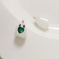 Detailed view of translucent ghost charms with green hearts and gold metal loops - Jelly White + Green Heart
