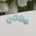 Macro shot of 12mm light blue acrylic flower beads with holes for DIY jewelry making - Light Blue