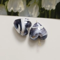 Macro shot of purple and white marbled heart glass beads with gold hook attachment - 1 Piece/Pack / Gray
