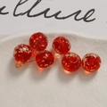 Macro shot of 12mm red luminous glass beads with flower patterns for DIY jewelry making - 12mm (1 Piece/Pack) / Red