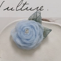 Detail of light blue mesh rose flower hair accessory with delicate pearl and green leaves - Sky Blue