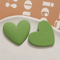 Close-up of matte avocado green heart-shaped resin charms for DIY jewelry making - Green