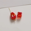 Macro detail of red tulip-shaped acrylic beads with iridescent finish and gold metal pins - Red Tulip (1 Piece)
