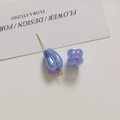Detail view of iridescent light blue tulip beads and petal charms for DIY jewelry - Dark Blue Tulip (1 Piece)