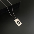 Silver titanium steel necklace featuring a rectangular pendant with a hollow D cutout - Letter D